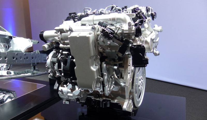 Supercharger on the side with integrated liquid-to-air intercooler.